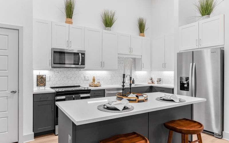 a kitchen with white cabinets