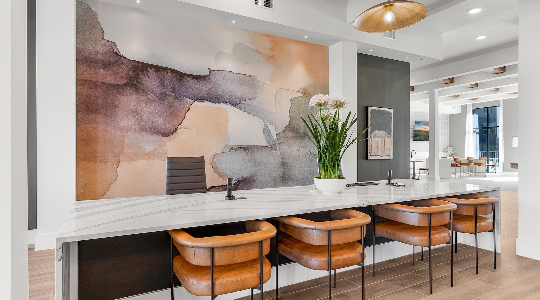 a clubhouse room with a large table and chairs