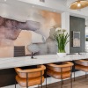 a clubhouse room with a large table and chairs