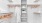 a white closet with shelves, hangers and arobe