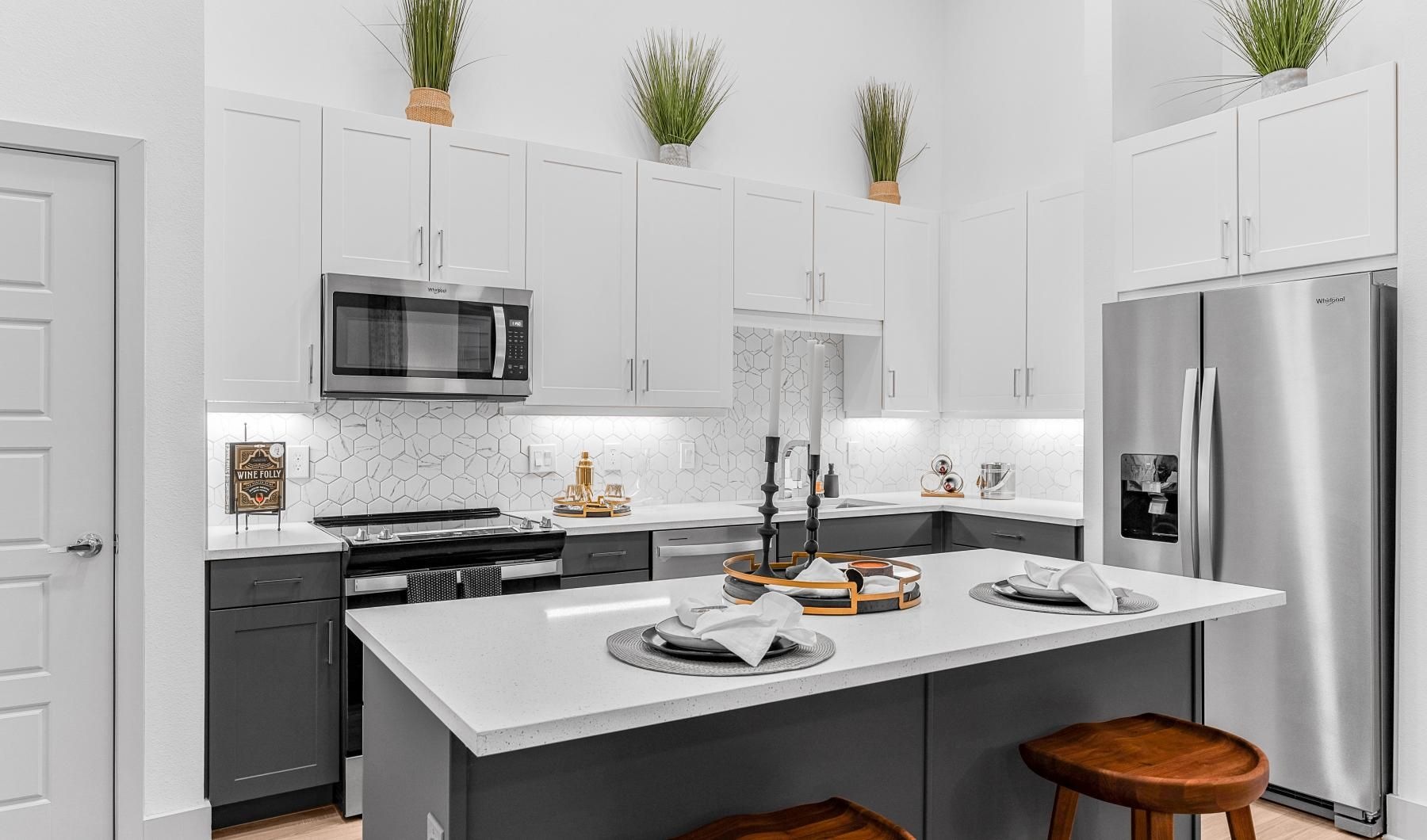 a kitchen with white cabinets